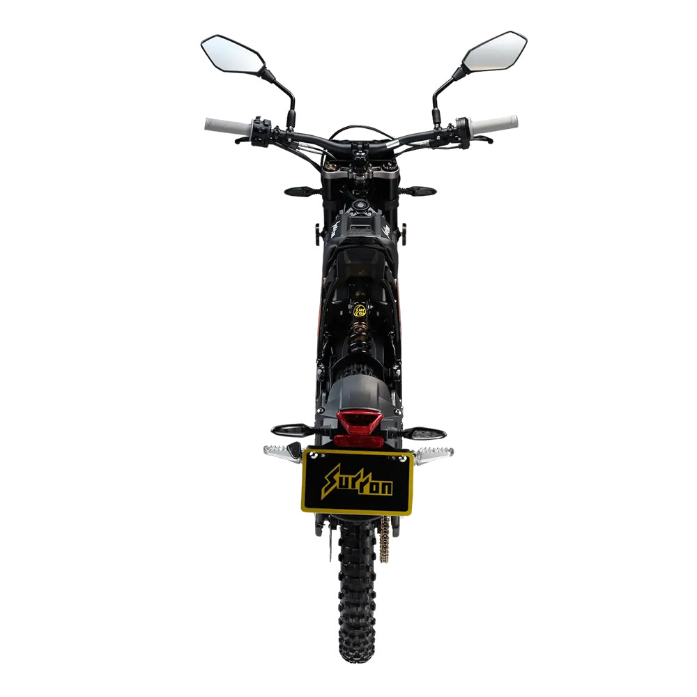 Black and orange sur-ron dirt bike with rearview mirror